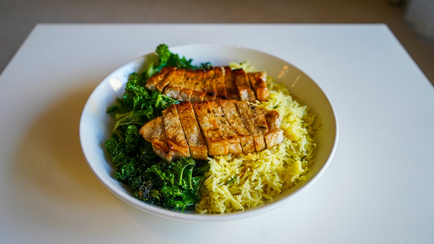 A plate of chicken with mashed potatoes and steamed broccoli